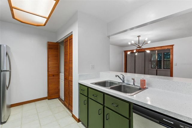 2822 SW 14th Dr Unit 307, Gainesville, FL 32608 - kitchen featuring green cabinetry, appliances with stainless steel finishes, light countertops, and washer / dryer