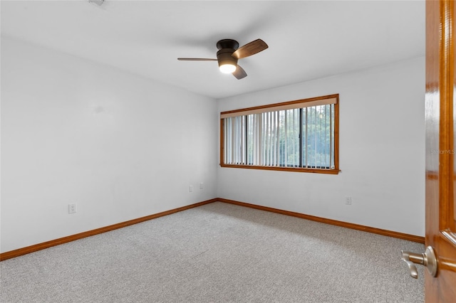2822 SW 14th Dr Unit 307, Gainesville, FL 32608 - carpeted spare room featuring a ceiling fan and baseboards