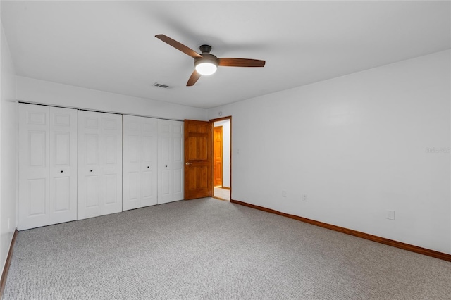 2822 SW 14th Dr Unit 307, Gainesville, FL 32608 - unfurnished bedroom with carpet, a closet, and a ceiling fan