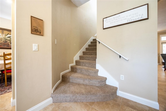 stairs featuring baseboards