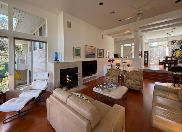 3200 NW 21st Ave, Gainesville, FL 32605 - living area featuring hardwood / wood-style flooring, plenty of natural light, a ceiling fan, and a tile fireplace