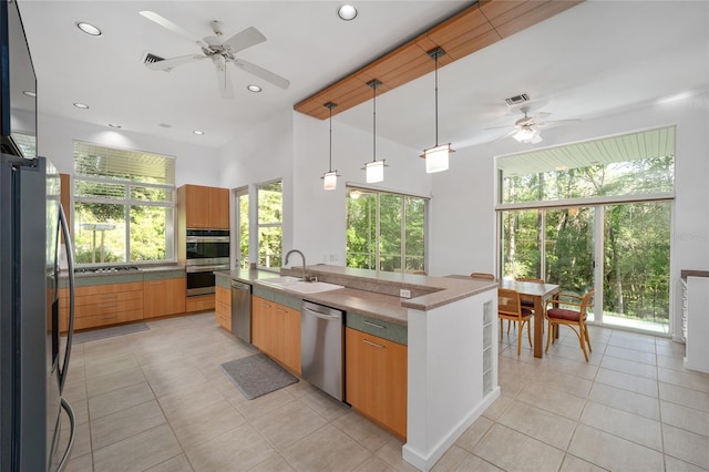 3200 NW 21st Ave, Gainesville, FL 32605 - kitchen featuring stainless steel appliances, a ceiling fan, light tile patterned floors, plenty of natural light, and recessed lighting