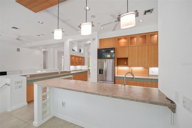 3200 NW 21st Ave, Gainesville, FL 32605 - kitchen featuring stainless steel fridge, a ceiling fan, recessed lighting, modern cabinets, and hanging light fixtures