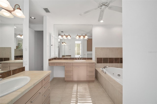 3200 NW 21st Ave, Gainesville, FL 32605 - bathroom featuring a jetted tub, two vanities, ceiling fan, tile patterned flooring, and recessed lighting