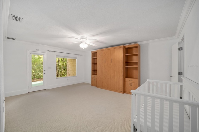 3200 NW 21st Ave, Gainesville, FL 32605 - unfurnished bedroom with light colored carpet, ornamental molding, baseboards, a ceiling fan, and access to outside
