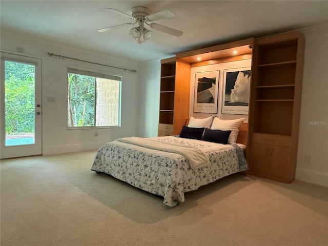 3200 NW 21st Ave, Gainesville, FL 32605 - bedroom with carpet flooring, access to exterior, baseboards, and ceiling fan