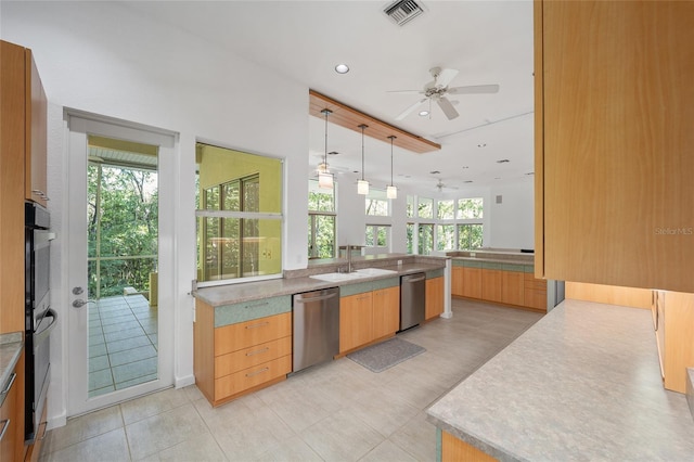 3200 NW 21st Ave, Gainesville, FL 32605 - kitchen with stainless steel dishwasher, a sink, ceiling fan, decorative light fixtures, and recessed lighting