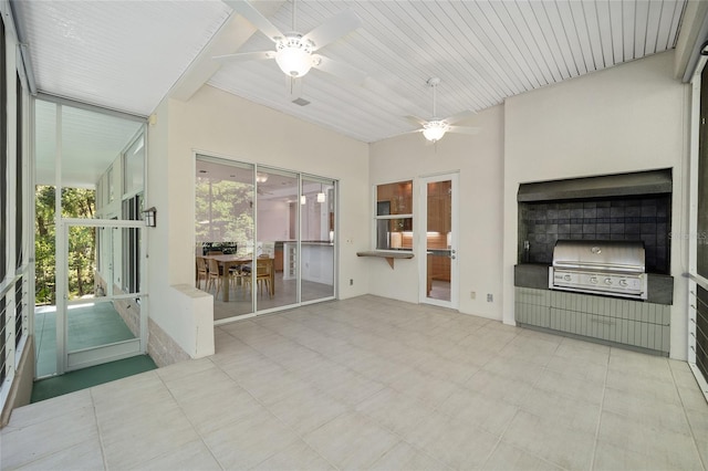 3200 NW 21st Ave, Gainesville, FL 32605 - unfurnished sunroom featuring an outdoor kitchen, plenty of natural light, and a ceiling fan