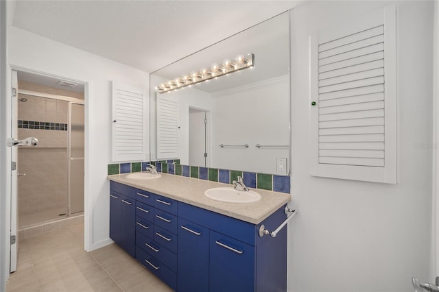 3200 NW 21st Ave, Gainesville, FL 32605 - bathroom with double vanity, a shower stall, and tile patterned floors