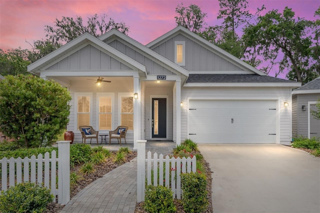 1272 NW 132nd Blvd, Newberry, FL 32669 - craftsman inspired home with covered porch, board and batten siding, driveway, fence, and a garage