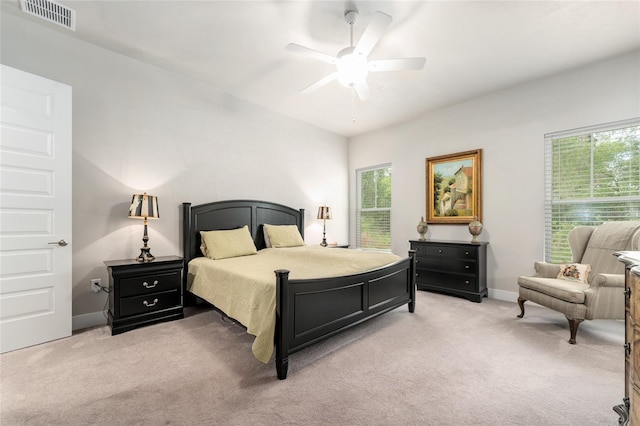 1272 NW 132nd Blvd, Newberry, FL 32669 - bedroom featuring light colored carpet, baseboards, and ceiling fan