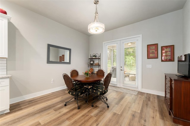 1272 NW 132nd Blvd, Newberry, FL 32669 - dining room featuring baseboards, light wood finished floors, and french doors