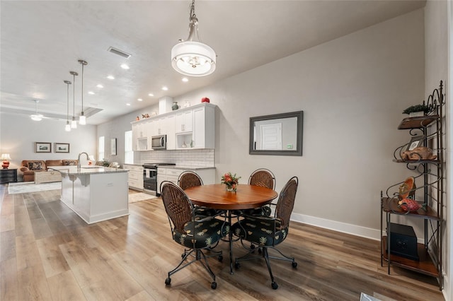 1272 NW 132nd Blvd, Newberry, FL 32669 - dining space featuring recessed lighting, light wood-style flooring, baseboards, and ceiling fan