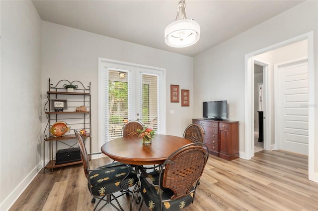 1272 NW 132nd Blvd, Newberry, FL 32669 - dining area featuring light wood-style flooring, baseboards, and french doors