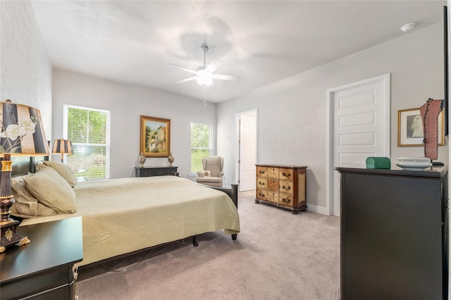1272 NW 132nd Blvd, Newberry, FL 32669 - bedroom with light carpet, multiple windows, and a ceiling fan