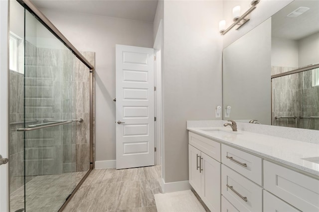 1272 NW 132nd Blvd, Newberry, FL 32669 - bathroom featuring a stall shower, double vanity, and baseboards