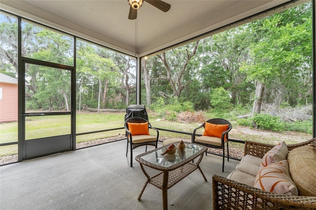1272 NW 132nd Blvd, Newberry, FL 32669 - sunroom / solarium with ceiling fan, an outdoor living space, and view of scattered trees