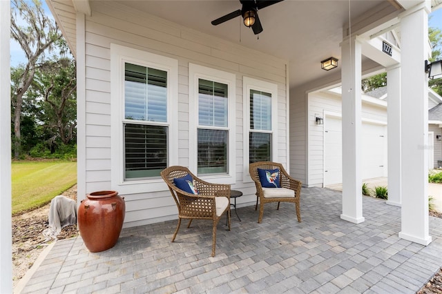 1272 NW 132nd Blvd, Newberry, FL 32669 - view of patio featuring ceiling fan and a garage