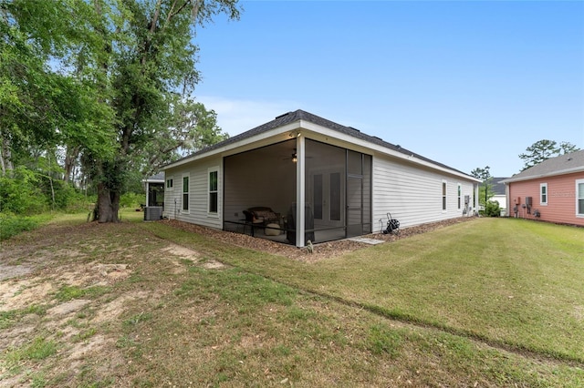 1272 NW 132nd Blvd, Newberry, FL 32669 - rear view of property featuring a lawn and a ceiling fan