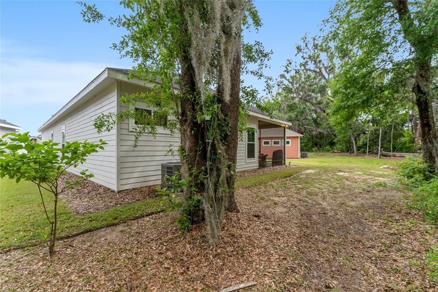 1272 NW 132nd Blvd, Newberry, FL 32669 - view of side of home with central AC