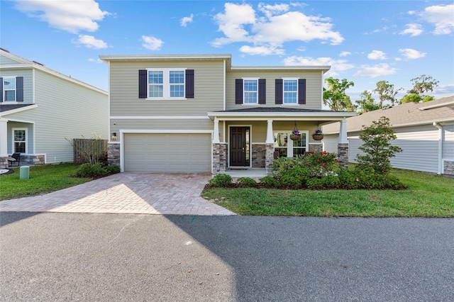 1487 NW 136th Blvd, Newberry, FL 32669 - craftsman-style home featuring driveway, a porch, stone siding, and a garage