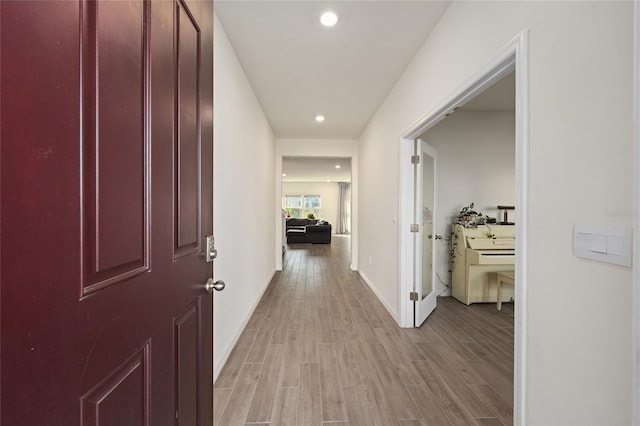 1487 NW 136th Blvd, Newberry, FL 32669 - corridor featuring baseboards, light wood-style flooring, and recessed lighting