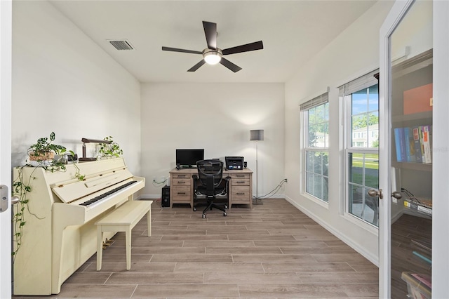 1487 NW 136th Blvd, Newberry, FL 32669 - office space with french doors, wood finish floors, baseboards, ceiling fan, and visible vents
