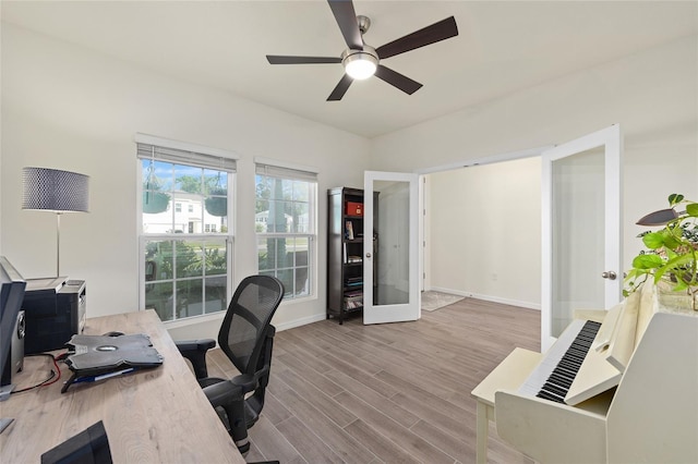 1487 NW 136th Blvd, Newberry, FL 32669 - office area with baseboards, wood finished floors, and ceiling fan