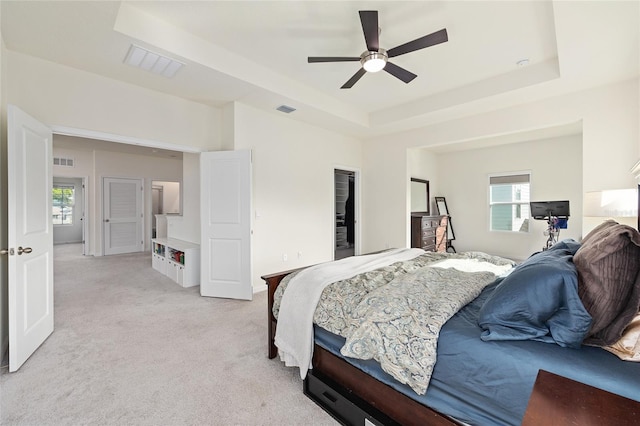1487 NW 136th Blvd, Newberry, FL 32669 - bedroom featuring a raised ceiling, visible vents, and light colored carpet