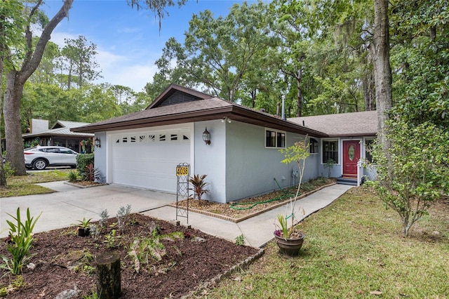 4038 NW 86th Blvd, Gainesville, FL 32653 - ranch-style home with an attached garage, concrete driveway, and a shingled roof