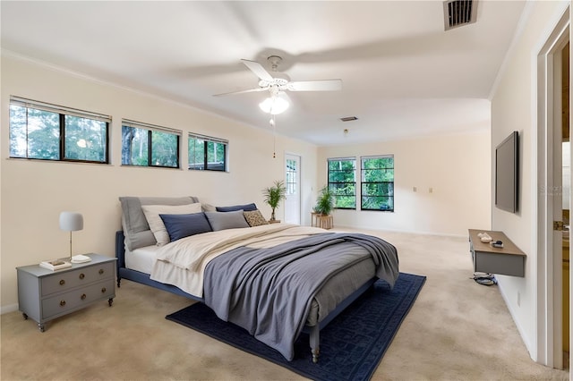 4038 NW 86th Blvd, Gainesville, FL 32653 - bedroom featuring light carpet, ceiling fan, and crown molding