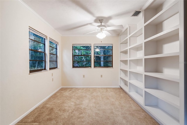 4038 NW 86th Blvd, Gainesville, FL 32653 - unfurnished room featuring light carpet, ornamental molding, and ceiling fan