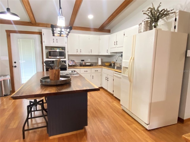 kitchen with white cabinets, a sink, light wood-type flooring, and white appliances