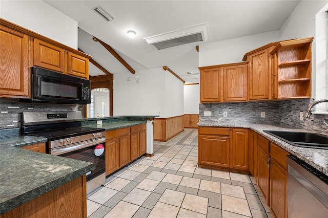 kitchen featuring open shelves, light tile patterned flooring, a sink, appliances with stainless steel finishes, and wainscoting