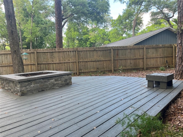 wooden terrace featuring fence