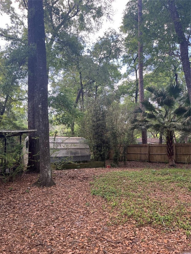 view of yard with fence