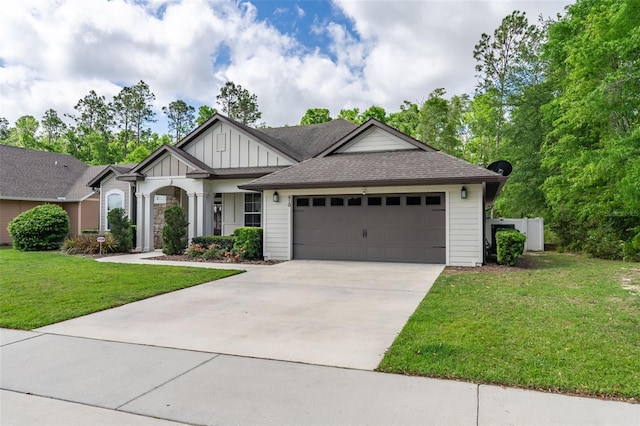 view of front of home featuring a garage, a front yard, a shingled roof, board and batten siding, and concrete driveway