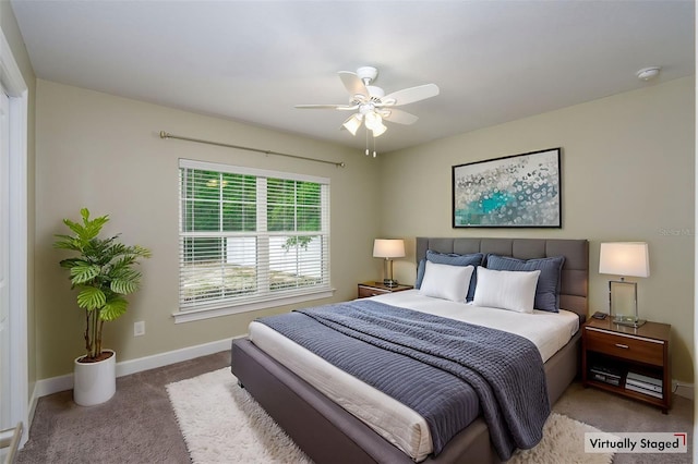 bedroom featuring carpet floors, baseboards, and ceiling fan