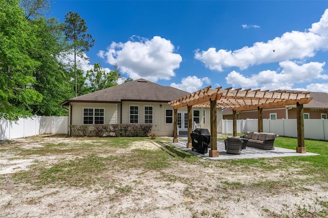 back of house with a fenced backyard, outdoor lounge area, a patio area, and a pergola