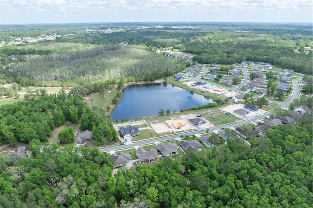 bird's eye view featuring a water view, a view of trees, and a residential view