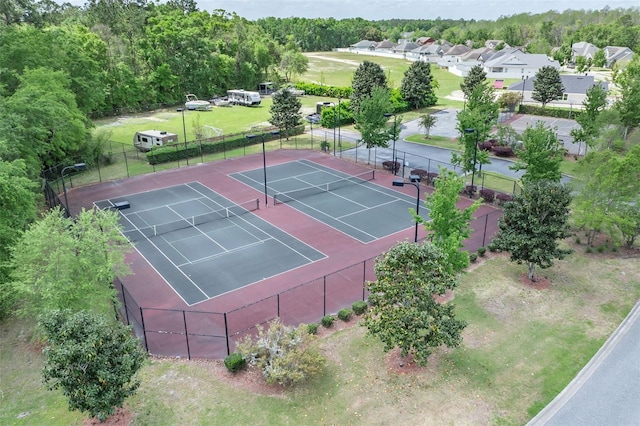 view of sport court with fence