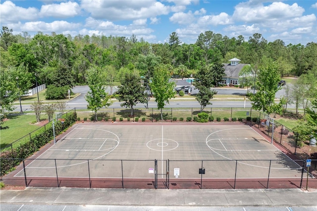 view of basketball court featuring fence and community basketball court