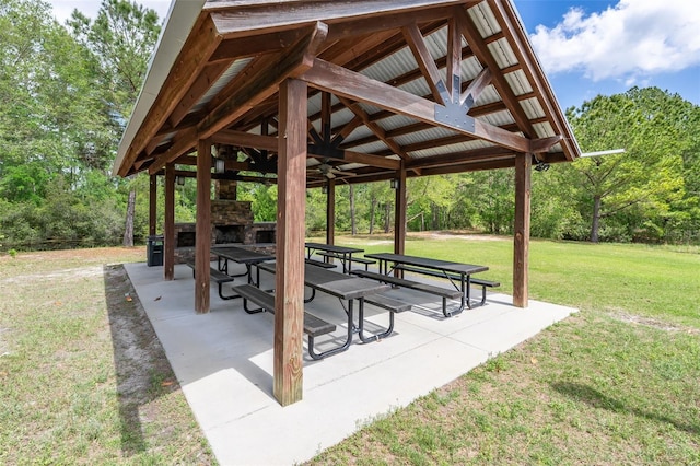 view of community featuring a yard, a patio, and a gazebo