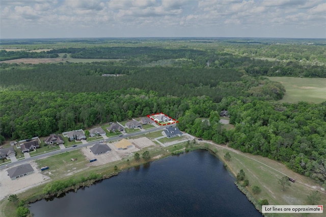 bird's eye view featuring a water view and a view of trees