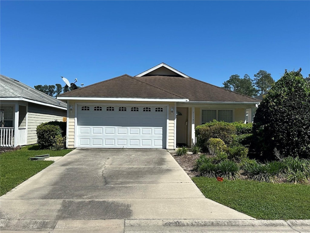 11747 NW 61st Ter, Alachua, FL 32615 - single story home with a garage and driveway