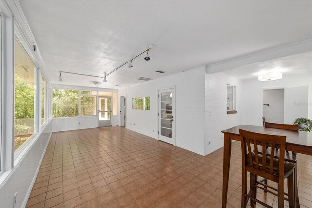 1711 NW 10th Ave, Gainesville, FL 32605 - unfurnished sunroom featuring rail lighting and french doors
