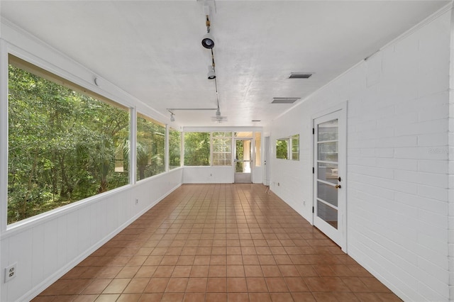 1711 NW 10th Ave, Gainesville, FL 32605 - unfurnished sunroom with rail lighting