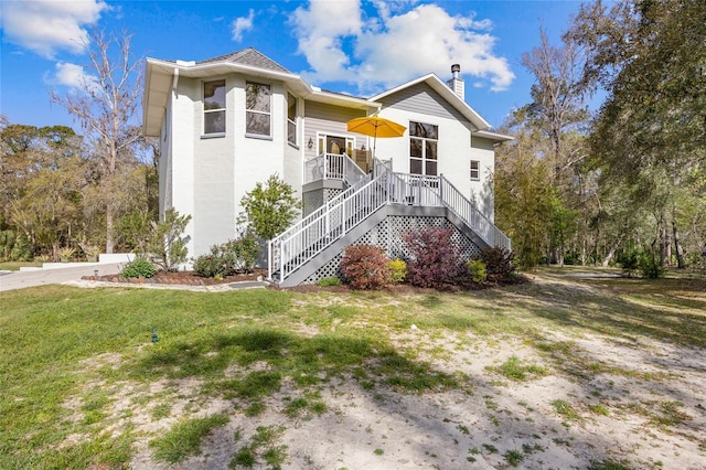 4250 NW 81st Ln, Bell, FL 32619 - exterior space with a front yard, stairway, and a chimney