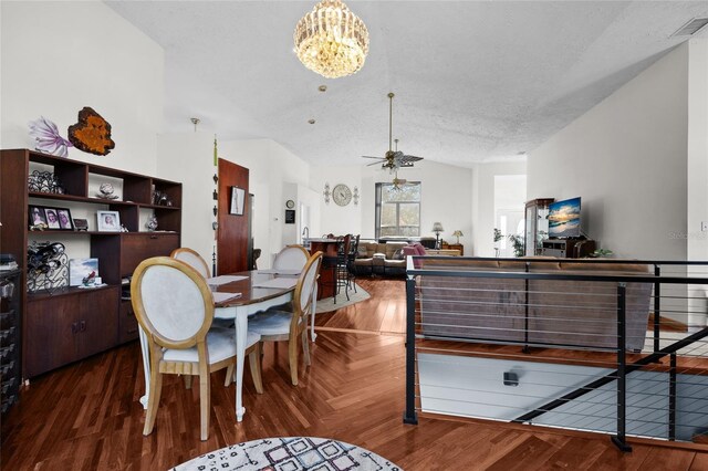 4250 NW 81st Ln, Bell, FL 32619 - dining area featuring a textured ceiling, parquet flooring, visible vents, lofted ceiling, and ceiling fan with notable chandelier