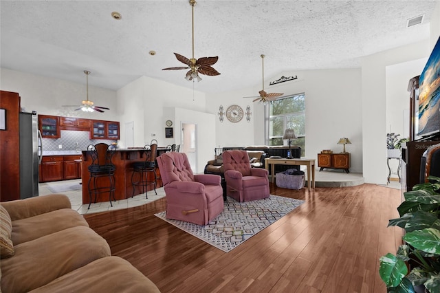 4250 NW 81st Ln, Bell, FL 32619 - living area with visible vents, a textured ceiling, a ceiling fan, and light wood finished floors